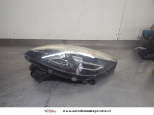 O208362 Gebruikte koplamp links Renault Scenic