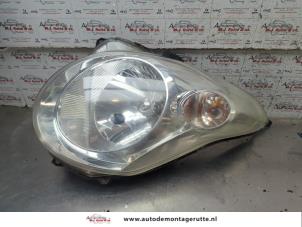 O209198 Gebruikte rechter koplamp Suzuki Alto