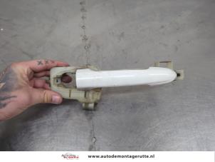 O209658 Gebruikte portiergreep 4deurs links-voor Kia Rio