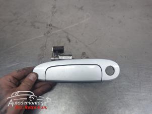 O209780 Gebruikte portiergreep 2deurs links Toyota Yaris