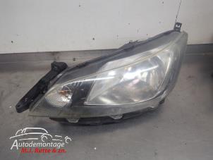 O210356 Gebruikte koplamp links Nissan NV200