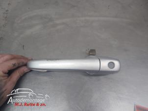 O210360 Gebruikte portiergreep 4deurs links-voor Mazda 2