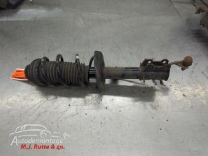 O210692 Gebruikte voorpoot links Opel Corsa