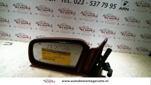 O84792 Gebruikte buitenspiegel links Mazda 121