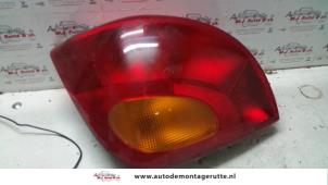 O93213 Gebruikte achterlicht links Mazda 121