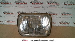 O72296 Gebruikte linker koplamp Mazda 323F
