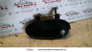 O80289 Gebruikte portiergreep 4deurs links-voor Daewoo Tacuma