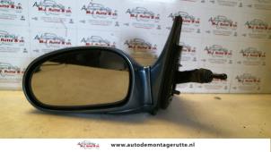 O85042 Gebruikte buitenspiegel links Kia Rio