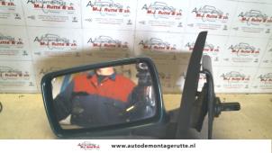 O84230 Gebruikte buitenspiegel links Ford Escort