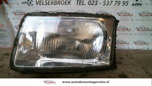 O71687 Gebruikte koplamp links Audi 100