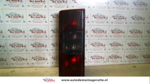 O92911 Gebruikte achterlicht links Opel Combo