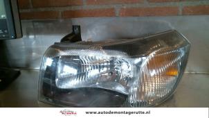 O71802 Gebruikte koplamp links Ford Transit
