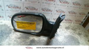 O85574 Gebruikte spiegel buiten links Daihatsu Cuore