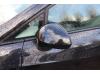 Spiegel Buiten links van een Seat Ibiza ST (6J8) 1.2 TDI Ecomotive 2012