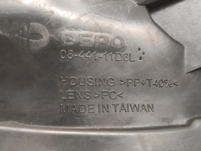 Koplamp links van een Volkswagen Polo V (6R) 1.2 12V BlueMotion Technology 2009