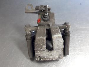 Gebruikte Remklauw (Tang) links-achter Renault Scénic II (JM) 1.5 dCi 105 FAP Prijs € 25,00 Margeregeling aangeboden door Autobedrijf Broekhuis B.V.