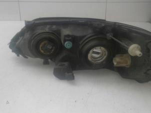 Gebruikte Koplamp rechts Opel Astra G (F08/48) Prijs € 85,00 Margeregeling aangeboden door Wessel Parts & Service B.V.