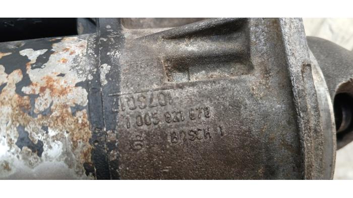 Startmotor van een Opel Calibra 2.5 V6 24V 1994