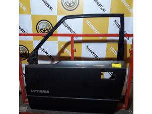 Gebruikte Portier 2Deurs links Suzuki Vitara (ET/FT/TA) 1.6i Prijs € 75,00 Margeregeling aangeboden door Yellow Parts