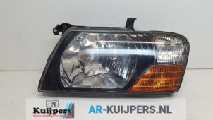 Gebruikte Linker Koplamp Mitsubishi Pajero Canvas Top (V6/7) 3.2 DI-D 16V Prijs € 49,00 Margeregeling aangeboden door Autorecycling Kuijpers