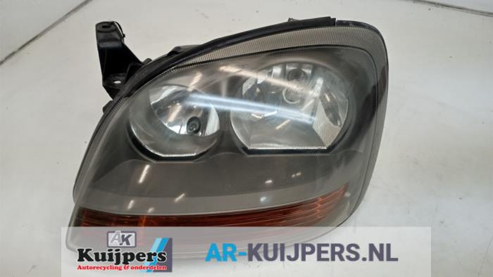 Koplamp links - Nissan Almera Tino