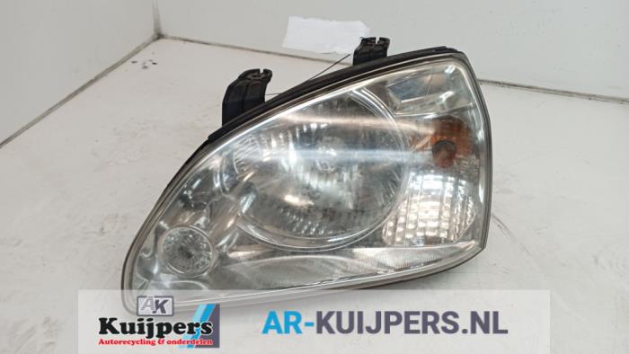 Koplamp links - Kia Carens