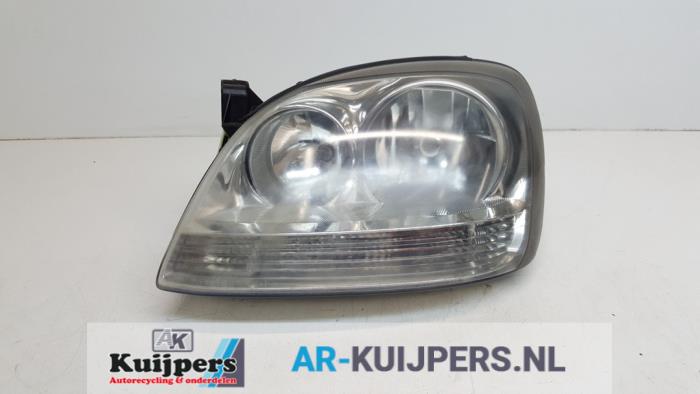 Koplamp links - Nissan Almera Tino