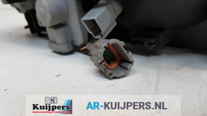 Koplamp links - Nissan Almera Tino