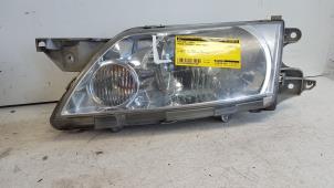 Gebruikte Koplamp links Mazda Premacy 1.8 16V Prijs € 30,00 Margeregeling aangeboden door Autodemontagebedrijf Smit
