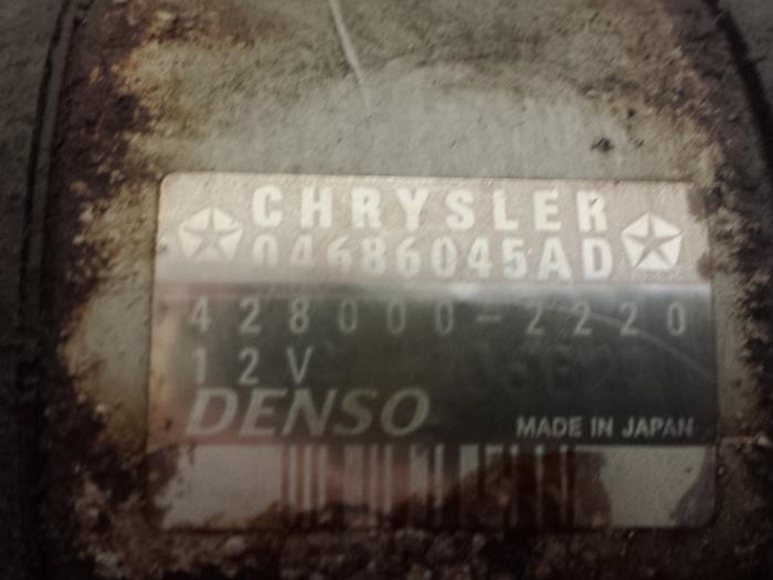 Startmotor van een Chrysler Voyager/Grand Voyager (RG/RS) 3.3 V6 AWD Grand Voyager 2004