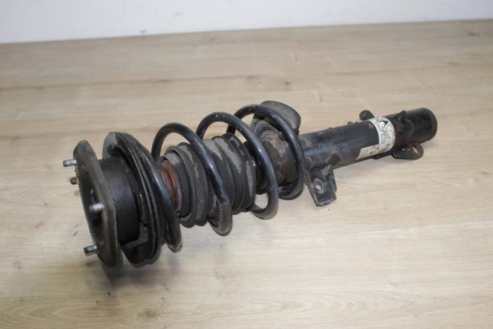 Schokdemper links-voor van een MINI Mini (R56) 1.6 16V Cooper 2006