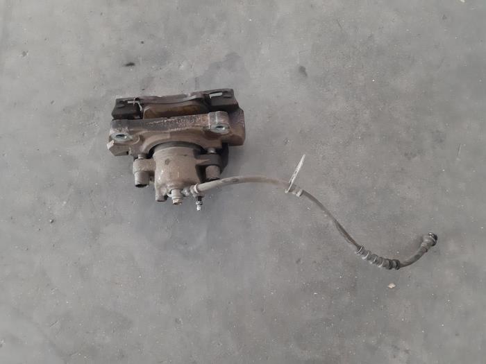 Front brake calliperholder, left Ford Mondeo