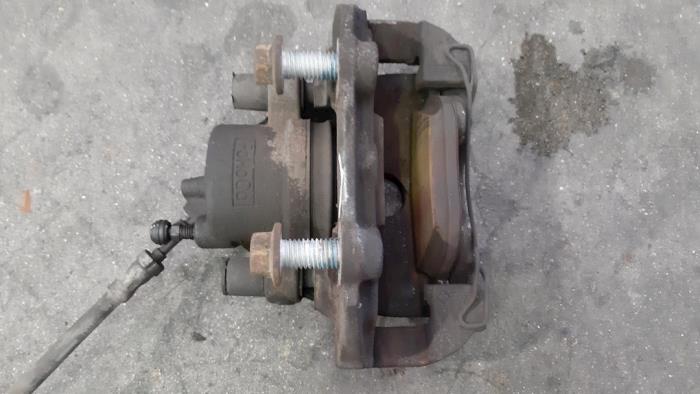 Front brake calliperholder, left Ford Tourneo Connect