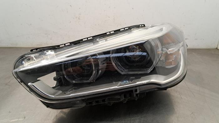 Headlight, left BMW X1