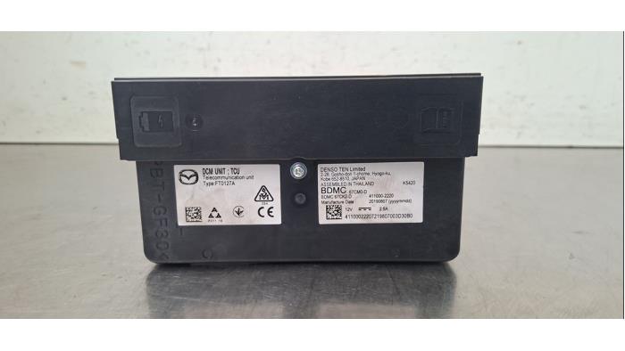 Module de communication Mazda 3.