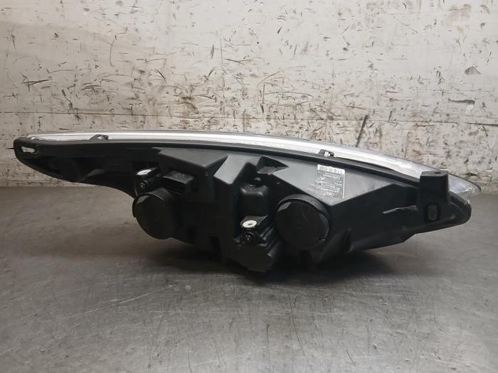 Koplamp links van een Ford B-Max (JK8) 1.0 EcoBoost 12V 125 2013