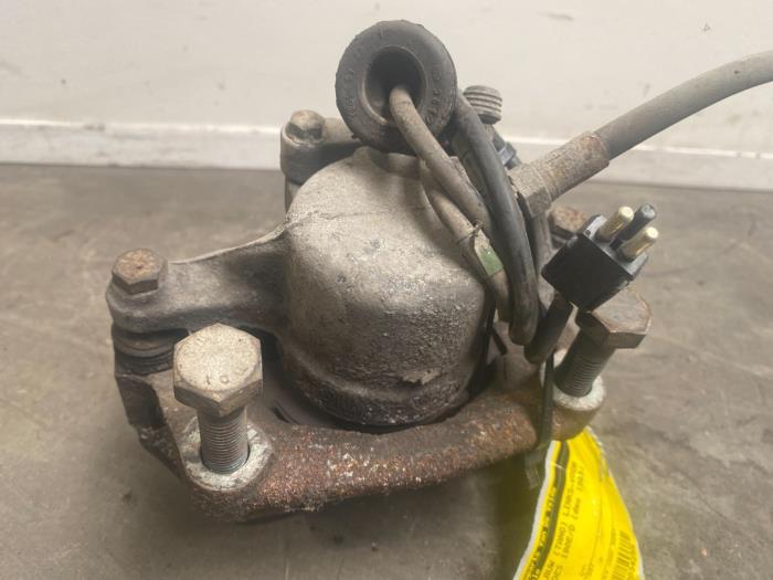 Front brake calliper, left Mercedes 190E/D