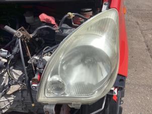 Gebruikte Linker Koplamp Daihatsu Cuore (L251/271/276) 1.0 12V DVVT Prijs € 70,00 Margeregeling aangeboden door Autohandel & Demontage Weteringbrug