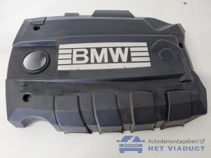 Gebruikte Afdekplaat motor BMW 1 serie (E81) 118i 16V Prijs € 35,00 Margeregeling aangeboden door Het Viaduct