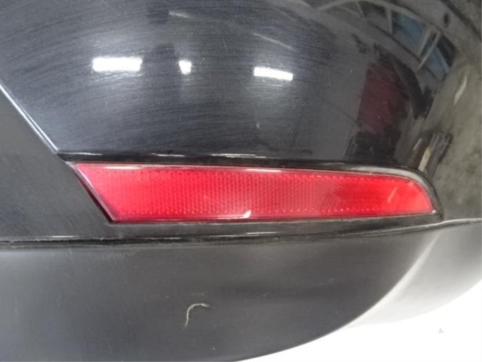 Bumper reflector rechts-achter van een Seat Ibiza IV SC (6J1) 1.4 TDI 2010