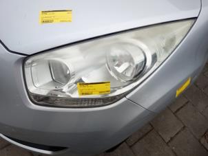 Gebruikte Koplamp links Kia Venga 1.4 CVVT 16V Prijs € 125,00 Margeregeling aangeboden door Smeets Autos Venlo